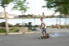 Cool dude riding a custom scooter at Lake Merritt